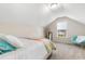 Attic bedroom with natural light and a colorful quilt on the bed at 263 Lakota Loop, Longs, SC 29568