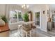Bright dining area featuring a pendant light and a view of the backyard through the window and door at 263 Lakota Loop, Longs, SC 29568