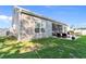 Exterior view showing the home's siding, windows, and access to the backyard patio at 263 Lakota Loop, Longs, SC 29568