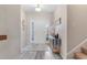 Bright foyer featuring wood-look flooring, with stairs to the right, and stylish decor at 263 Lakota Loop, Longs, SC 29568