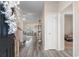 Inviting entryway with wood floors leading into a living area, showcasing modern shelving at 263 Lakota Loop, Longs, SC 29568