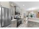 Contemporary kitchen featuring stainless steel appliances, gas range, and ample counter space at 263 Lakota Loop, Longs, SC 29568
