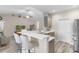 Open kitchen featuring a breakfast bar, stainless steel appliances, and seamless flow to living space at 263 Lakota Loop, Longs, SC 29568