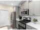 Well-equipped kitchen boasting stainless steel appliances, gas range, and abundant storage at 263 Lakota Loop, Longs, SC 29568