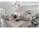 Spacious living room with vaulted ceilings and an open floor plan that flows into the kitchen at 263 Lakota Loop, Longs, SC 29568