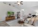 Comfortable living room features vaulted ceilings, a ceiling fan, and a large entertainment center at 263 Lakota Loop, Longs, SC 29568
