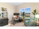 Bright home office with a large window, house plants, and comfortable seating at 263 Lakota Loop, Longs, SC 29568