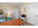 Well-lit home office with a comfortable chair, desk, and artwork at 263 Lakota Loop, Longs, SC 29568