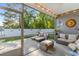 Relaxing screened-in patio with lounge chairs and comfortable seating area, perfect for enjoying the outdoors at 263 Lakota Loop, Longs, SC 29568