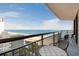 Balcony view of beach and ocean with table and chairs at 2710 N Ocean Blvd. # 804, Myrtle Beach, SC 29577
