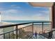 Relaxing balcony view overlooking the ocean and beach with table and chairs at 2710 N Ocean Blvd. # 804, Myrtle Beach, SC 29577