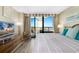 Inviting bedroom with balcony access, beachfront view, and entertainment center at 2710 N Ocean Blvd. # 804, Myrtle Beach, SC 29577