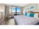 Bright bedroom with ocean view, balcony, and decoratively painted walls at 2710 N Ocean Blvd. # 804, Myrtle Beach, SC 29577