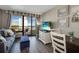 The living room features an ocean view, comfortable seating, and flat screen television at 2710 N Ocean Blvd. # 804, Myrtle Beach, SC 29577