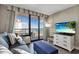 Living room boasts ocean view, comfy seating, and flat screen television at 2710 N Ocean Blvd. # 804, Myrtle Beach, SC 29577