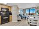 Open concept living area with stainless steel appliances and a balcony at 2710 N Ocean Blvd. # 804, Myrtle Beach, SC 29577
