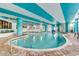 Bright indoor pool area with a modern design and brick floor at 2710 N Ocean Blvd. # 804, Myrtle Beach, SC 29577