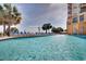 Beautiful outdoor pool area with lounge chairs and palm trees at 2710 N Ocean Blvd. # 804, Myrtle Beach, SC 29577