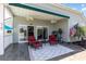 A covered back porch with ceiling fans, great seating area, and view of the lake at 2940 Tigers Eye Rd., Little River, SC 29566