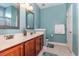 Stylish bathroom features double vanity, quartz countertops, and ample lighting at 2940 Tigers Eye Rd., Little River, SC 29566