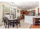 Cozy dining area next to the kitchen with a large window for natural light at 2940 Tigers Eye Rd., Little River, SC 29566