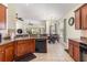 Kitchen and dining area featuring wood cabinets and tile flooring at 2940 Tigers Eye Rd., Little River, SC 29566