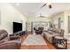 Cozy living room featuring hardwood floors, a ceiling fan, and sliding glass doors at 2940 Tigers Eye Rd., Little River, SC 29566