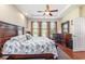 A bright and open main bedroom features hardwood floors, three windows and a view of the outside at 2940 Tigers Eye Rd., Little River, SC 29566