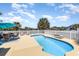 An in-ground pool surrounded by a well-manicured patio with lake views and plenty of seating at 2940 Tigers Eye Rd., Little River, SC 29566