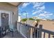 Cozy balcony with views overlooking nearby rooftops and the city skyline in the distance at 311 2Nd Ave. N # 210, North Myrtle Beach, SC 29582
