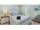 Inviting bedroom featuring a decorative bedframe and side tables illuminated by lamps at 311 2Nd Ave. N # 210, North Myrtle Beach, SC 29582