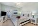 Cozy bedroom featuring a comfortable bed, a TV, and access to a private balcony at 311 2Nd Ave. N # 210, North Myrtle Beach, SC 29582