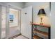 Inviting entryway with a view to the outdoor patio, a warm lamp, and tiled flooring at 311 2Nd Ave. N # 210, North Myrtle Beach, SC 29582