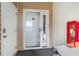 Exterior entryway featuring a secure door and a visible fire extinguisher box at 311 2Nd Ave. N # 210, North Myrtle Beach, SC 29582