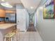 Hallway with artwork leading to the kitchen and other areas of the home at 311 2Nd Ave. N # 210, North Myrtle Beach, SC 29582
