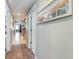 Hallway with art leading to various rooms in the home at 311 2Nd Ave. N # 210, North Myrtle Beach, SC 29582