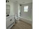 Bright bathroom with modern fixtures including a tub, toilet, and vanity at 326 15Th Ave. S, Surfside Beach, SC 29575