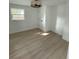 Comfortable bedroom with light wood flooring, a ceiling fan, and natural light at 326 15Th Ave. S, Surfside Beach, SC 29575