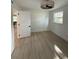Well-lit bedroom featuring a ceiling fan, closet, light wood flooring, and window at 326 15Th Ave. S, Surfside Beach, SC 29575
