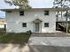 Charming two-story home with a gray front door, gray-trimmed windows, and a well-manicured front yard at 326 15Th Ave. S, Surfside Beach, SC 29575
