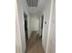 Hallway features luxury vinyl plank flooring and white trim at 326 15Th Ave. S, Surfside Beach, SC 29575