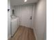 Functional laundry area with washer, dryer, and door leading outside at 326 15Th Ave. S, Surfside Beach, SC 29575
