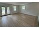 Sunlit living room features luxury vinyl plank flooring and modern windows at 326 15Th Ave. S, Surfside Beach, SC 29575
