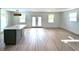 Spacious open-concept living room features luxury vinyl plank flooring at 326 15Th Ave. S, Surfside Beach, SC 29575