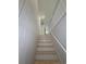 Stairway with white risers ascends to the upper level of the home at 326 15Th Ave. S, Surfside Beach, SC 29575