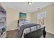 Comfortable bedroom featuring a black bed frame, a navy comforter, and natural light from the window at 381 Winslow Ave., Myrtle Beach, SC 29588