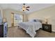 Comfortable bedroom features natural light, ceiling fan, carpet, and stylish furnishings at 381 Winslow Ave., Myrtle Beach, SC 29588