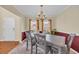 Bright dining room with large windows and a modern chandelier at 381 Winslow Ave., Myrtle Beach, SC 29588
