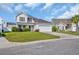 Two story home with neutral siding, a two car garage, and a well manicured lawn at 381 Winslow Ave., Myrtle Beach, SC 29588