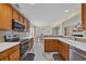 Updated kitchen with stainless steel appliances and wood cabinets at 381 Winslow Ave., Myrtle Beach, SC 29588
